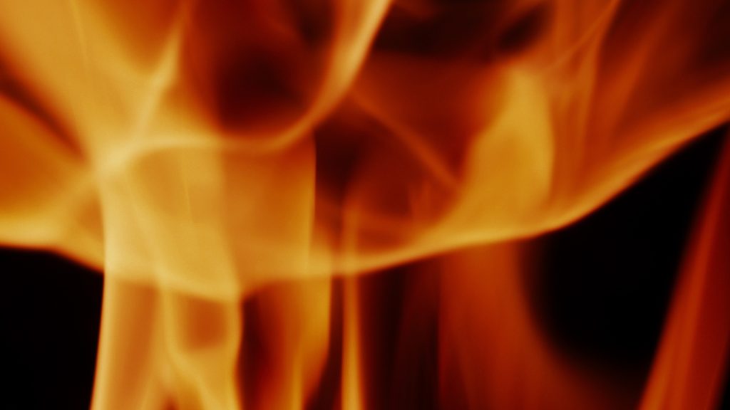 Fire background. Abstract burning flame and black background. represents the power of burning refers