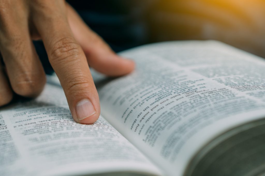The man read Bible on sunday morning.